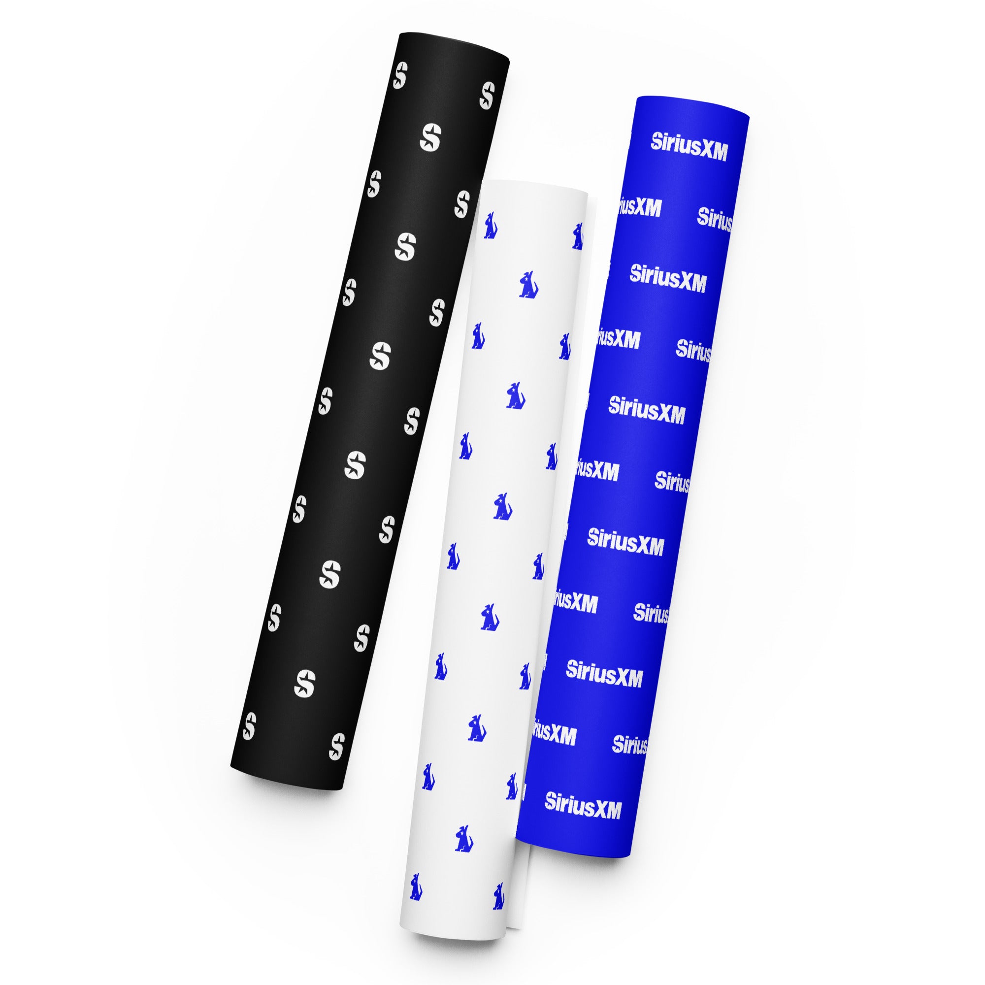 Three rolls of wrapping paper in black, white, and blue featuring logos for 'SiriusXM' branding in a repleated pattern.